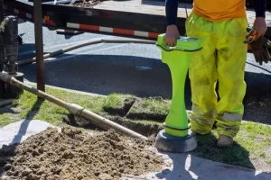technician working on pipe bursting installation.