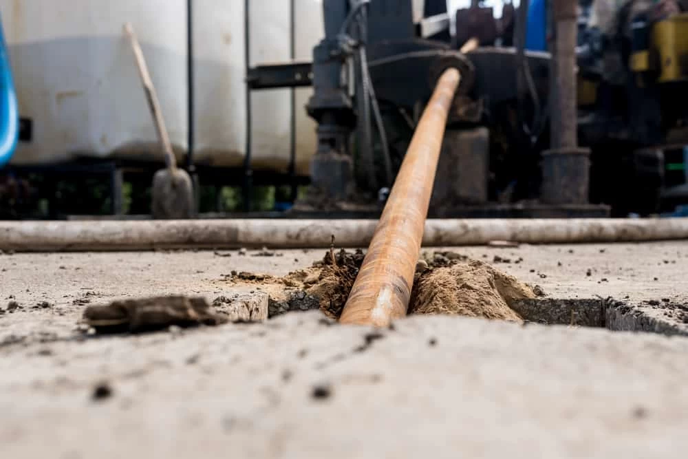 Low-angle shot of a horizontal directional drilling machine used for trenchless underground pipe installation