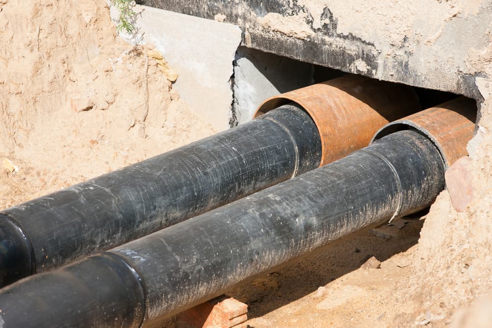 old pipes with pipe lining being installed.