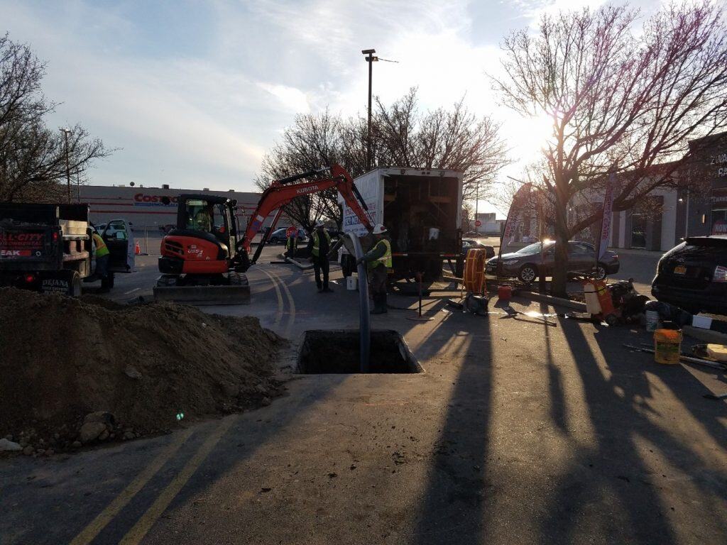 Pipe bursting service in Long Island, NY, showcasing a professional team performing trenchless technology to replace damaged or old water and sewer pipes